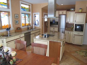 Cottage-style kitchen by Jan Niebler of Jan Niebler Interiors features Everlife granite